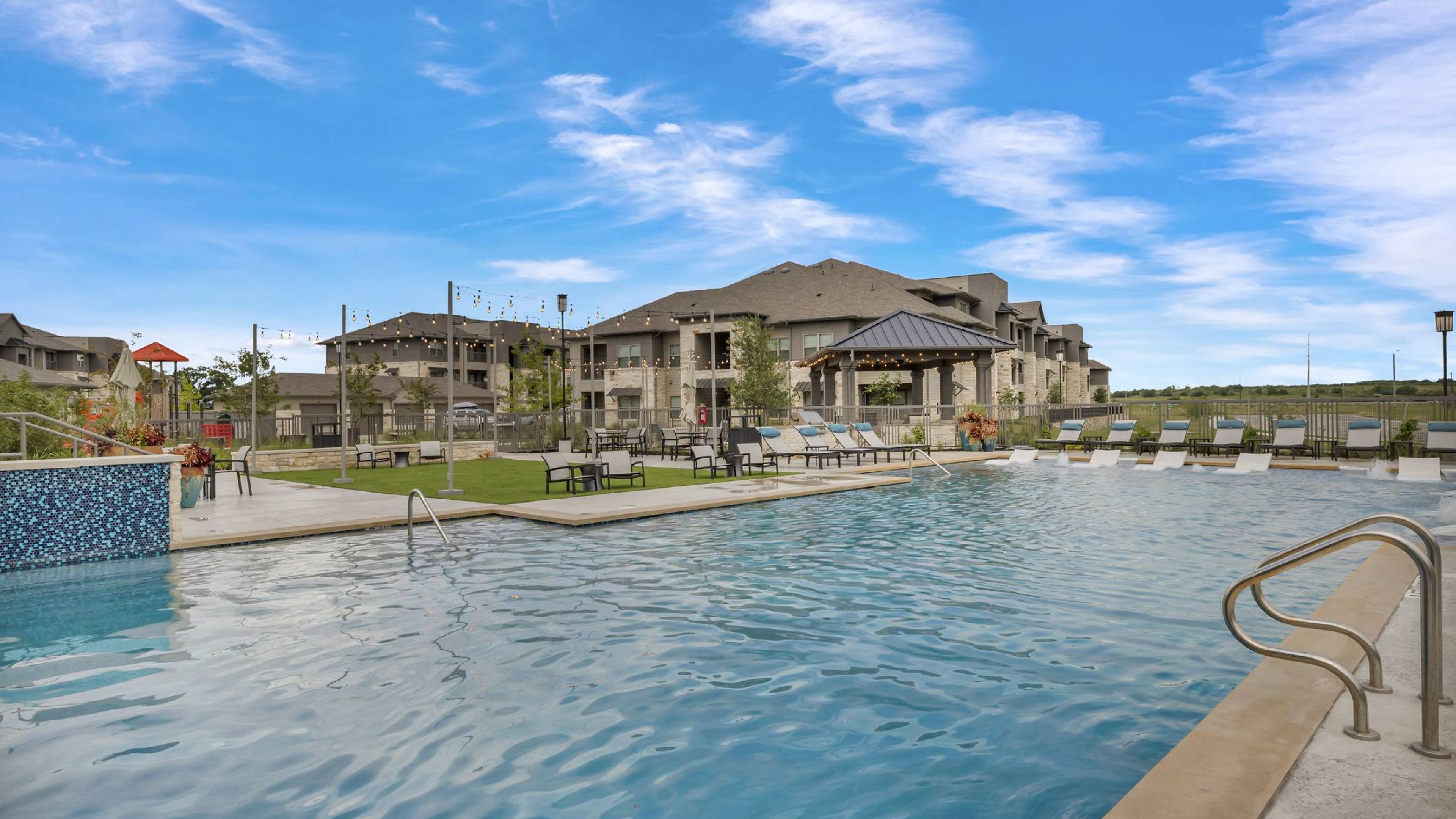 Hawthorne at Blanco Riverwalk outdoor lawn with lounge gazebo, grilling area, playground, and fire pit