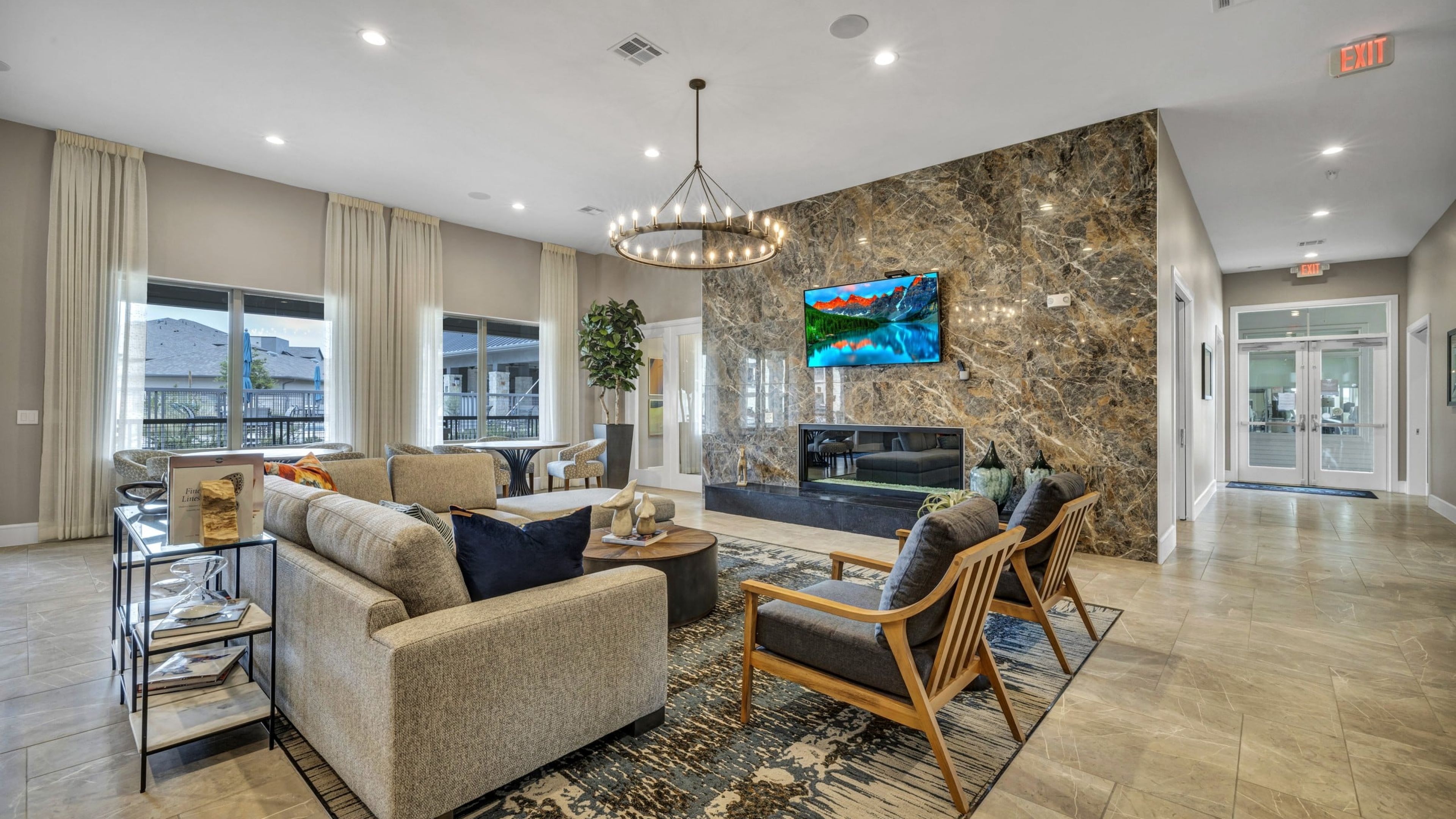 Hawthorne at Blanco Riverwalk resident clubhouse amenity with seating area, indoor fireplace, and beautiful finishes