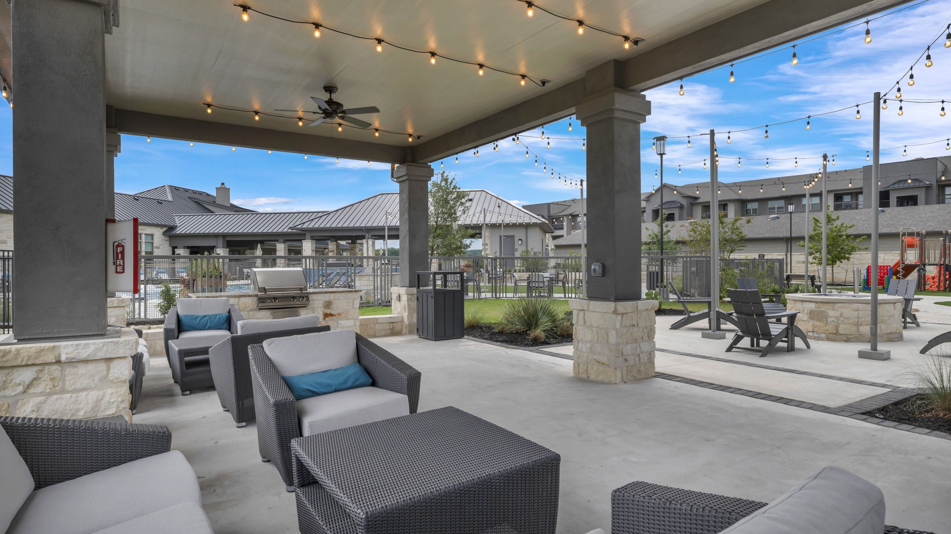 Hawthorne at Blanco Riverwalk outdoor lawn with lounge gazebo, grilling area, playground, and fire pit